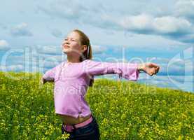 The girl on a green meadow