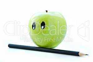 green apple with pencil isolated on white