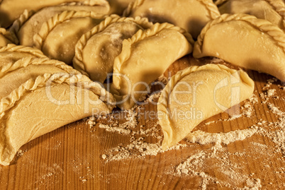 dumplings on the table with flour