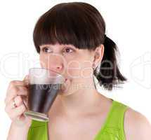 The young woman drinks coffee