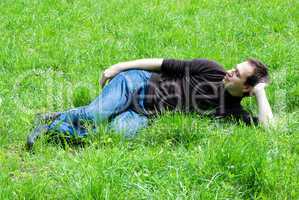 man sitting on green grass