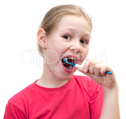 The girl brushes teeth a tooth brush
