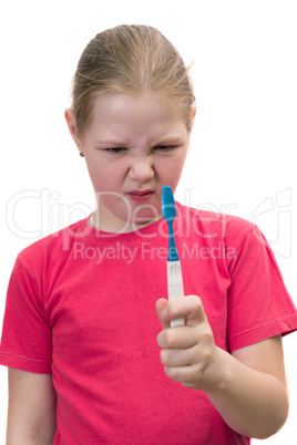 The girl brushes teeth a tooth brush