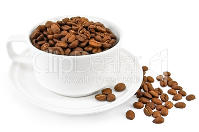 Coffee grains in a white cup on the table