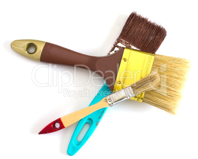 three paint brushes isolated on white