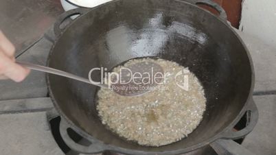 EDIT Collecting chicken fat with slotted spoon