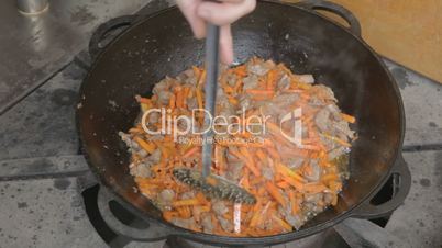 EDIT Turning with slotted spoon slices of pork and carrots