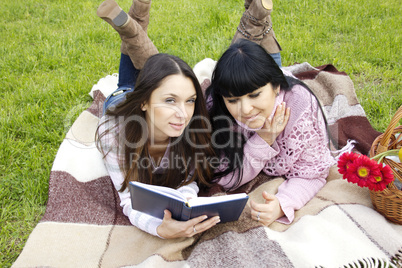 Mom and daughter reading a book