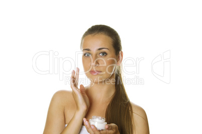 Beautiful girl holding cream