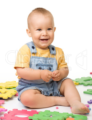 Little boy play with alphabet