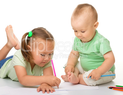 Two children are drawing