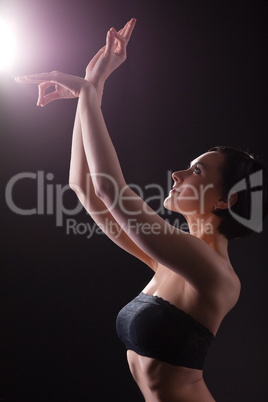 Beauty woman in dark with yoga sign
