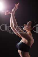 Beauty woman in dark with yoga sign