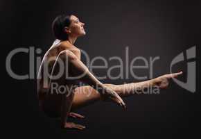 nude beauty woman in dark exercise yoga