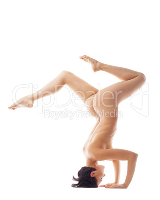 naked beauty woman in yoga stand on head
