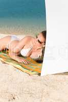 Young sexy bikini model relaxing with sunglasses