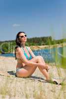 Summer beach woman in blue bikini