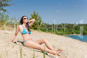Summer beach woman in blue bikini
