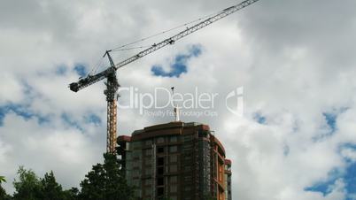 Construction crane working against the blue sky