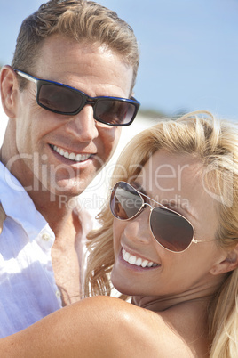 Happy Attractive Woman and Man Couple In Sunglasses At Beach