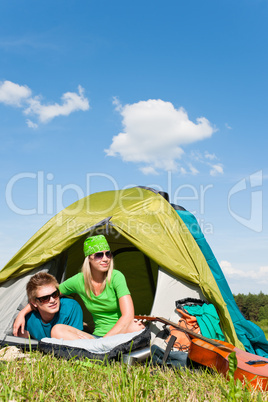 Camping couple lying inside tent summer countryside