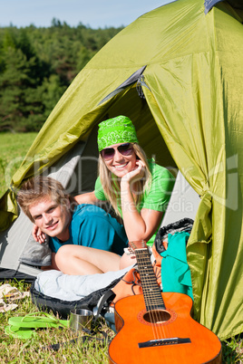 Camping couple lying inside tent summer countryside