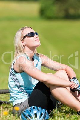 Sport mountain biking girl relax in meadows