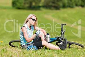 Sport mountain biking girl relax in meadows