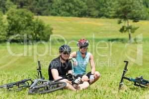 Sport mountain biking couple relax sunny meadows