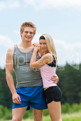 Sportive young couple happy posing in coutryside