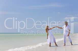 Happy Young Couple Dancing Holding Hands on A Tropical Beach