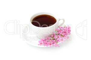 A cup of black coffee with flowers