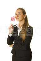 Attractive business woman with a lollipop