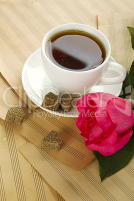 A cup of tea and rose