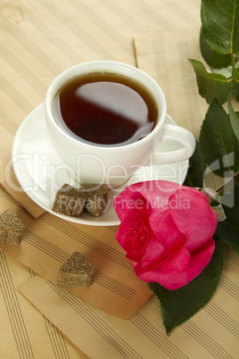 A cup of tea and rose