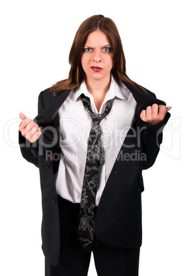 Brunette woman in a mens suit looking irritated