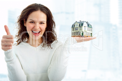 young woman with little house