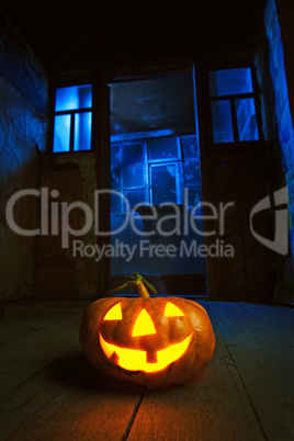 halloween pumpkin in night on old wood room