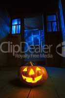 halloween pumpkin in night on old wood room