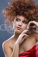 beauty redheaded girl in fashion dress