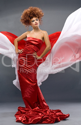 beauty redheaded girl in fashion dress