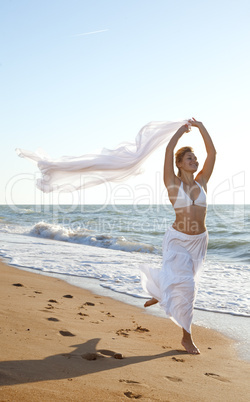 woman running on the sea beach