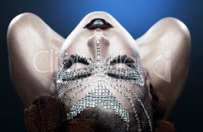 beauty woman makeup with crystals on face