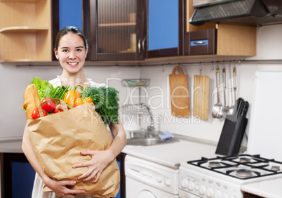 young beautiful caucasian woman in the kitchen