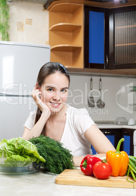 young beautiful caucasian woman in the kitchen