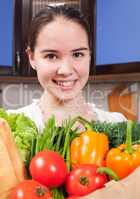 young beautiful caucasian woman in the kitchen