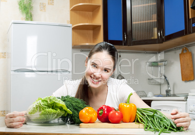 young beautiful caucasian woman in the kitchen