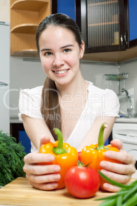 young beautiful caucasian woman in the kitchen