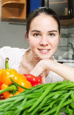 young beautiful caucasian woman in the kitchen