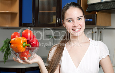 young beautiful caucasian woman in the kitchen